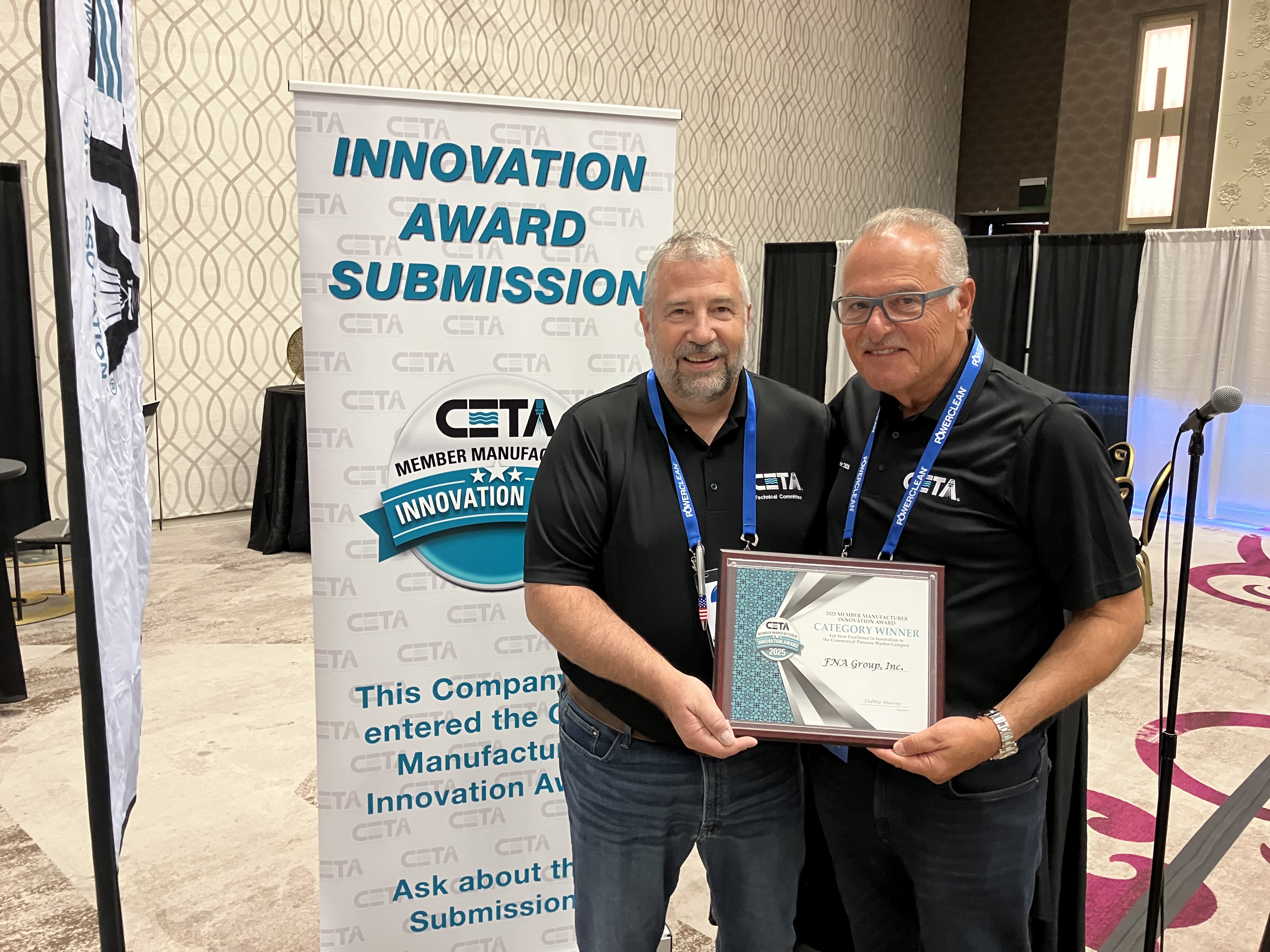 FNA Group's Gus Alexander accepting the 2025 CETA Innovation Award.