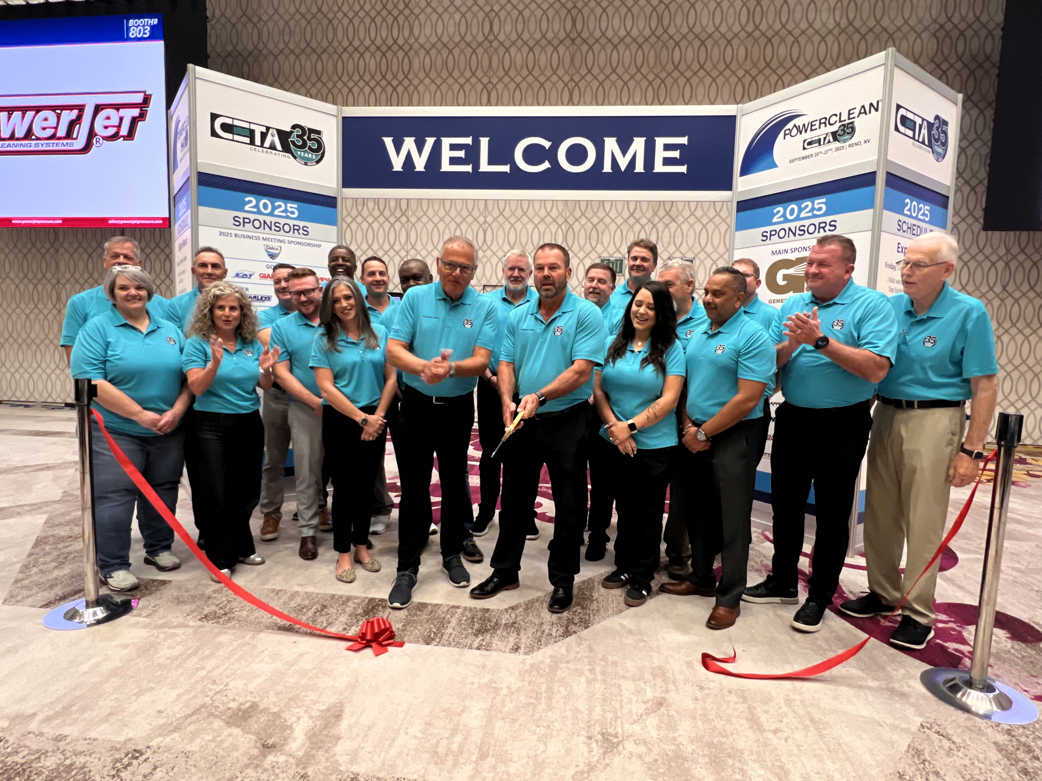 CETA Board members celebrating the ribbon cutting for the 2025 PowerClean convention